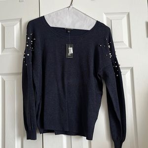 Sweater embellished with pearls. Never worn.